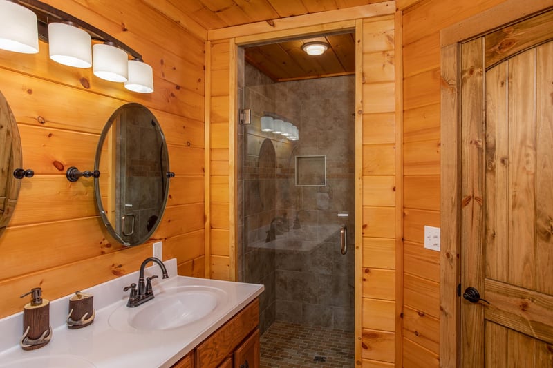 Bathroom with a walk in glass shower at Four Seasons Palace, a 5bedroom cabin rental located in Pigeon Forge