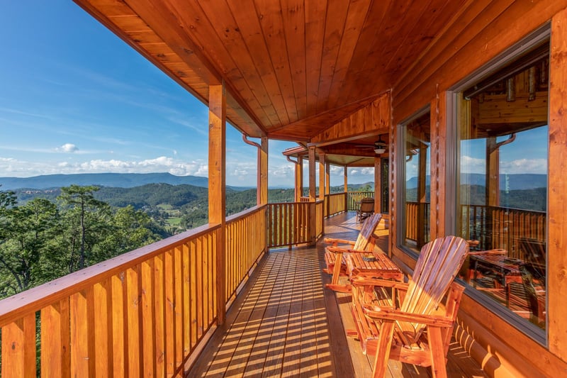 Plenty of deck seating at Four Seasons Palace, a 5bedroom cabin rental located in Pigeon Forge