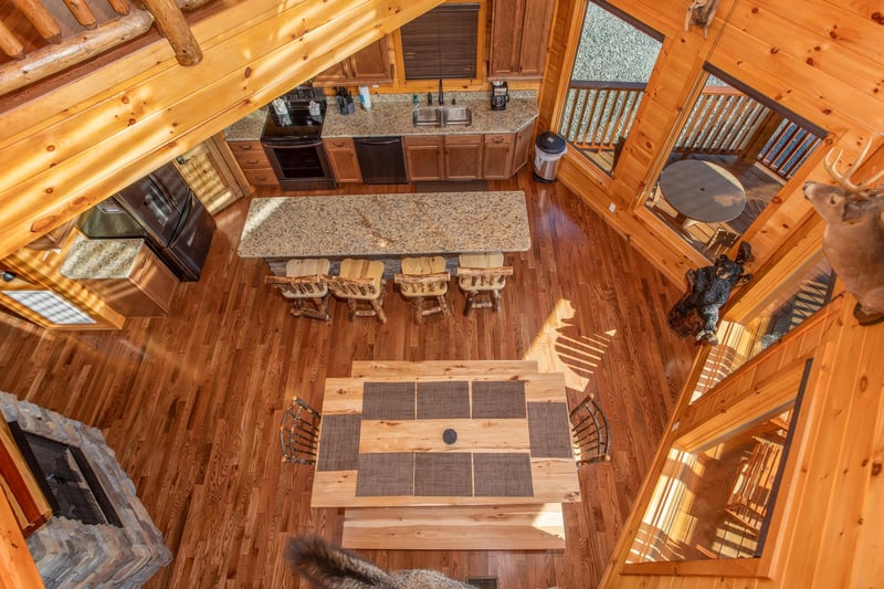 Looking down into the dining space for 12 people at Four Seasons Palace, a 5bedroom cabin rental located in Pigeon Forge