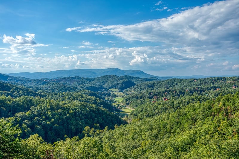 Views of the mountains surrounding a valley at Four Seasons Palace, a 5bedroom cabin rental located in Pigeon Forge