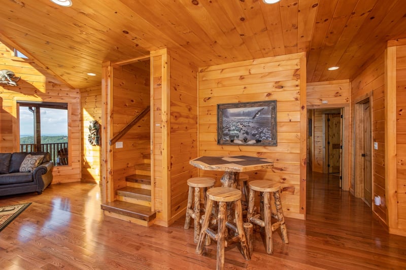 High table with seating for four at Four Seasons Palace, a 5bedroom cabin rental located in Pigeon Forge