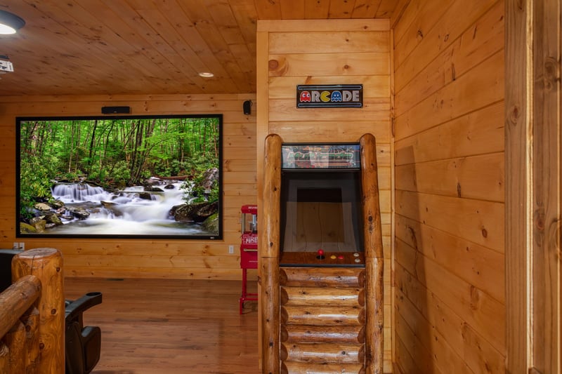 Arcade game in the theater room at Four Seasons Palace, a 5bedroom cabin rental located in Pigeon Forge