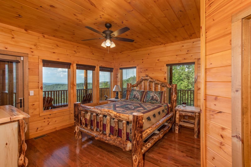 Bedroom with a log bed at Four Seasons Palace, a 5bedroom cabin rental located in Pigeon Forge