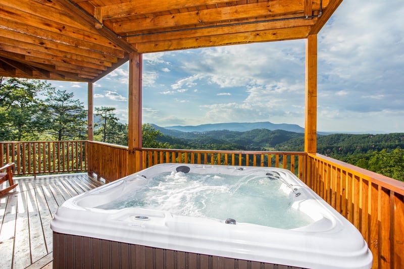 Hot tub overlooking the mountains at Four Seasons Palace, a 5bedroom cabin rental located in Pigeon Forge