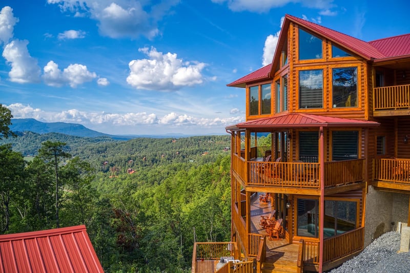 Cabin sitting in front of the mountains at Four Seasons Palace, a 5bedroom cabin rental located in Pigeon Forge