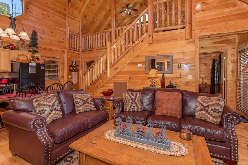 Living room couch and loveseat seating at Bears Eye View, a 2bedroom cabin rental located in Pigeon Forge