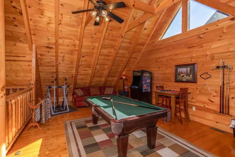 Green felted pool table in the loft at Bears Eye View, a 2bedroom cabin rental located in Pigeon Forge