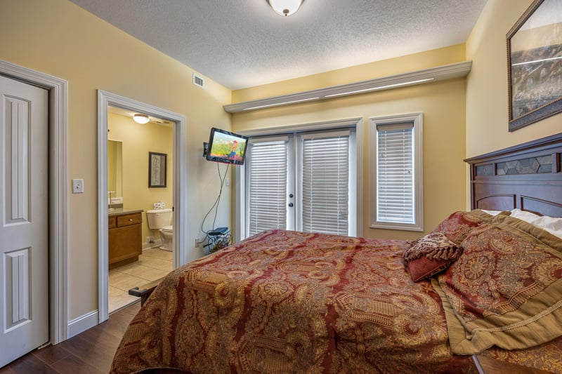 Queen bedroom at Heart of Gatlinburg, a 2 bedroom cabin rental located in Gatlinburg