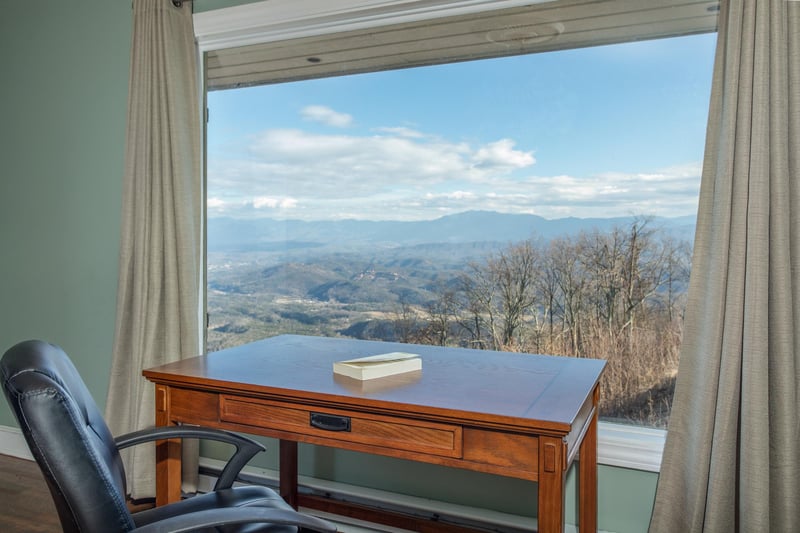 Writing desk in front of a window with mountain views at Best View Ever A 5 bedroom cabin rental in Pigeon Forge