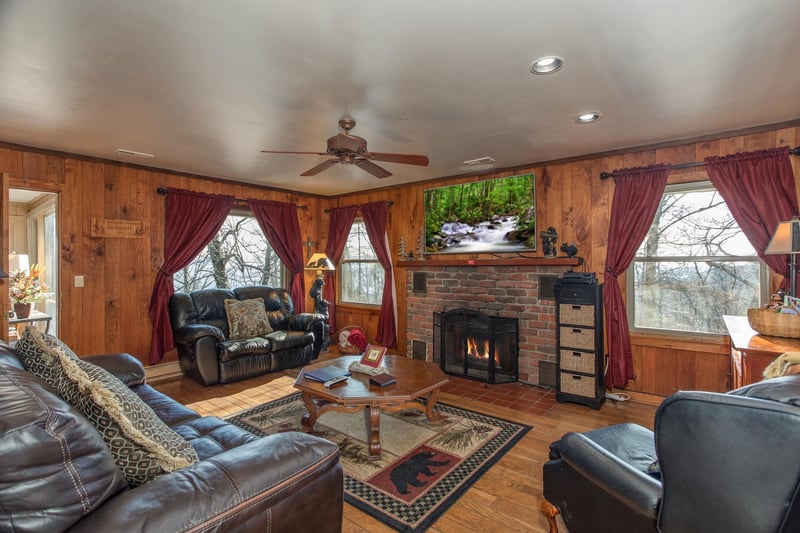 Fireplace and TV in the main living room at Best View Ever A 5 bedroom cabin rental in Pigeon Forge