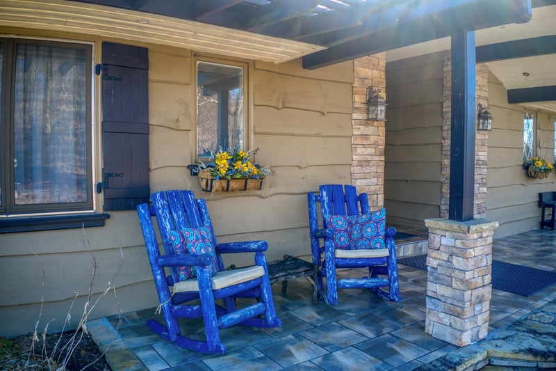 Blue rocking chairs on the patio at Best View Ever A 5 bedroom cabin rental in Pigeon Forge