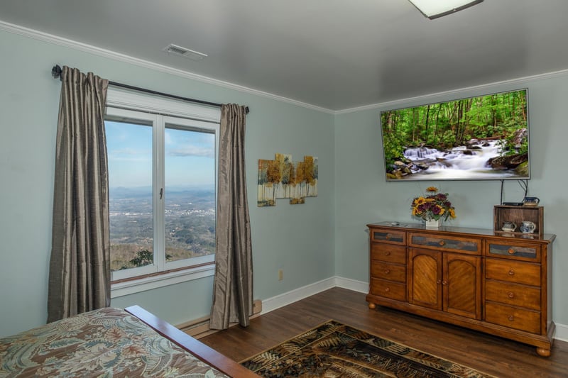 Dresser and TV in a bedroom at Best View Ever A 5 bedroom cabin rental in Pigeon Forge