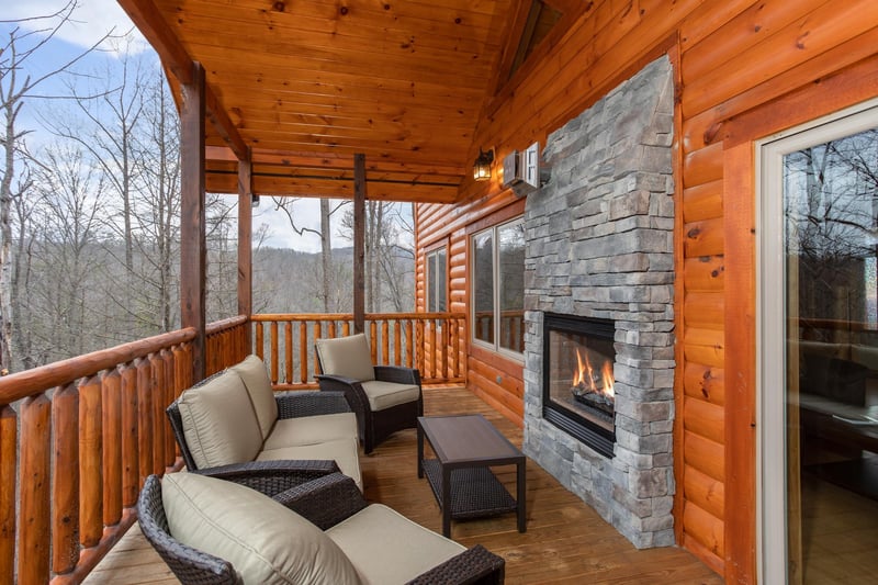 Outdoor seating area with see through fireplace at Happy Bears Hideaway, a 2 bedroom cabin rental located in Gatlinburg