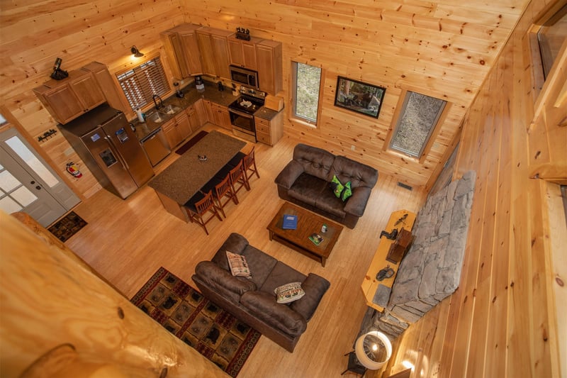 Looking down onto the main floor at Happy Bears Hideaway, a 2 bedroom cabin rental located in Gatlinburg