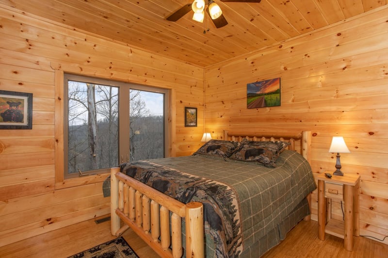 Bedroom with a log bed at Happy Bears Hideaway, a 2 bedroom cabin rental located in Gatlinburg