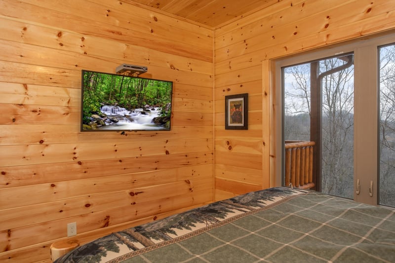 Wall mounted TV at Happy Bears Hideaway, a 2 bedroom cabin rental located in Gatlinburg