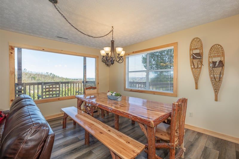 Dining room table at Le Bear Chalet, a 7 bedroom cabin rental located in Gatlinburg