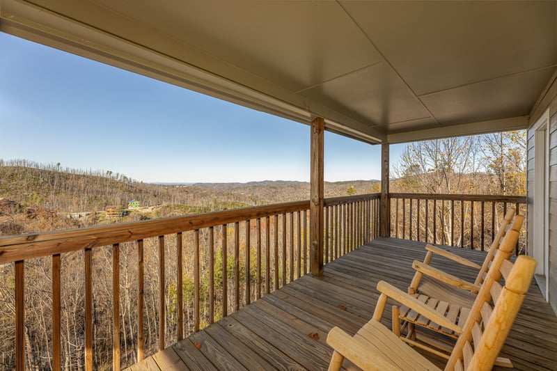 Deck with rocking chairs at Le Bear Chalet, a 7 bedroom cabin rental located in Gatlinburg