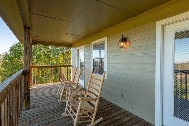 Deck with rocking chairs at Le Bear Chalet, a 7 bedroom cabin rental located in Gatlinburg