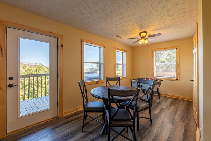 Card table and foosball in a game room at Le Bear Chalet, a 7 bedroom cabin rental located in Gatlinburg