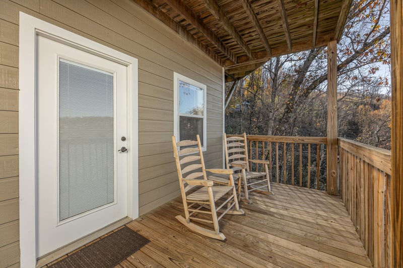 Rocking chairs on the deck at Le Bear Chalet, a 7 bedroom cabin rental located in Gatlinburg