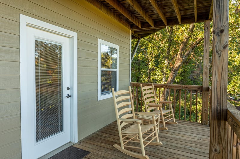 Rocking chairs on the deck at Le Bear Chalet, a 7 bedroom cabin rental located in Gatlinburg