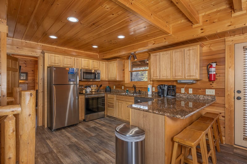 Kitchen with stainless appliances at Loving Every Minute, a 5 bedroom cabin rental located in Pigeon Forge