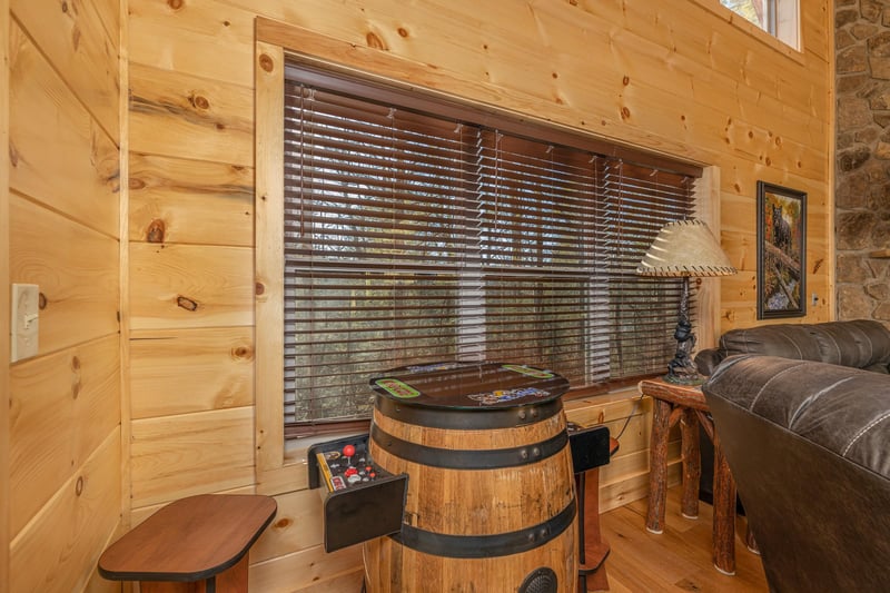 Arcade game in the living room at Bessy Bears Cabin, a 2 bedroom cabin rental located inGatlinburg