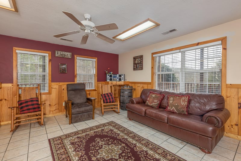 Furniture in the game room at Almost Bearadise, a 4 bedroom cabin rental located in Pigeon Forge