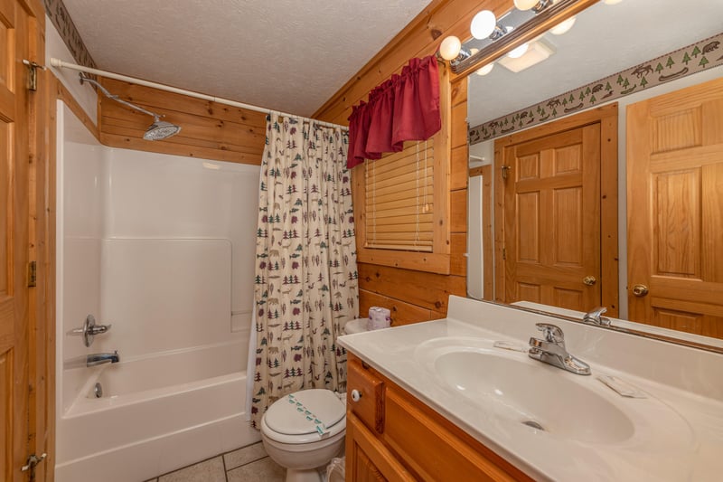 Bathroom with tub and shower at Cubs Crossing, a 3 bedroom cabin rental located in Gatlinburg