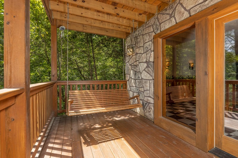 Porch swing at Cubs Crossing, a 3 bedroom cabin rental located in Gatlinburg