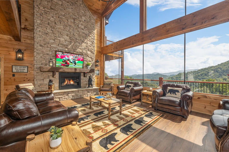 Living room with fireplace and TV at Black Bears  Biscuits Lodge, a 6 bedroom cabin rental located in Pigeon Forge