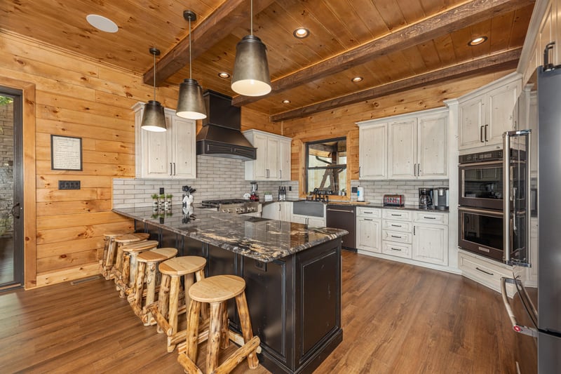 Breakfast bar with seating for five at Black Bears  Biscuits Lodge, a 6 bedroom cabin rental located in Pigeon Forge