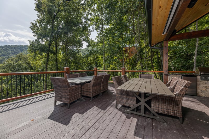 Outdoor dining tables at Black Bears  Biscuits Lodge, a 6 bedroom cabin rental located in Pigeon Forge