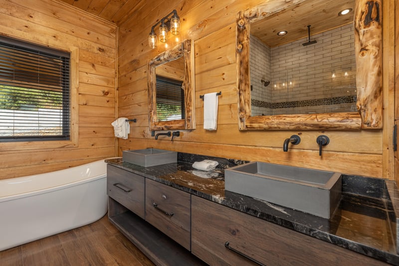 Double vanity and soaker tub in a bathroom at Black Bears  Biscuits Lodge, a 6 bedroom cabin rental located in Pigeon Forge