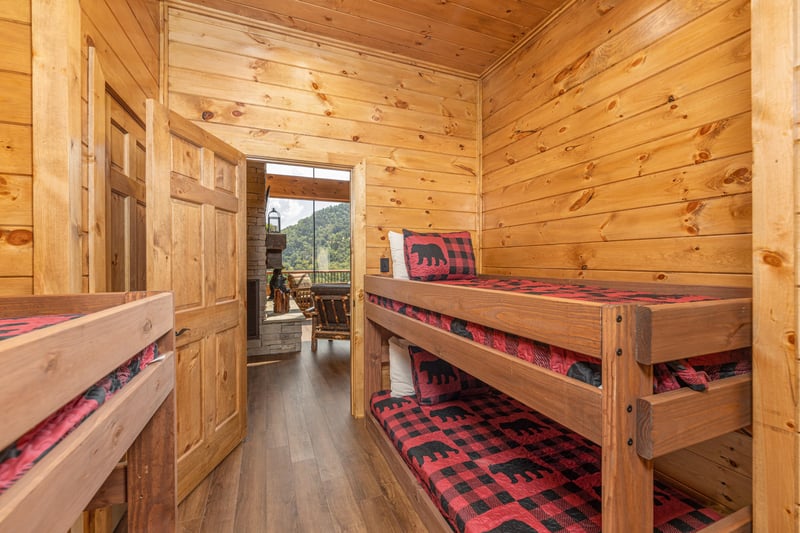 Bedroom with four twin bunk beds at Black Bears  Biscuits Lodge, a 6 bedroom cabin rental located in Pigeon Forge