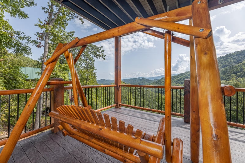 Deck swing at Black Bears  Biscuits Lodge, a 6 bedroom cabin rental located in Pigeon Forge