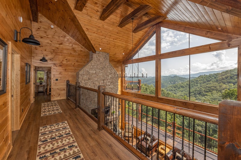 Upstairs catwalk with large windows at Black Bears  Biscuits Lodge, a 6 bedroom cabin rental located in Pigeon Forge