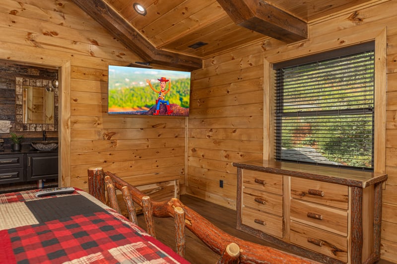 Dresser and TV in a bedroom at Black Bears  Biscuits Lodge, a 6 bedroom cabin rental located in Pigeon Forge