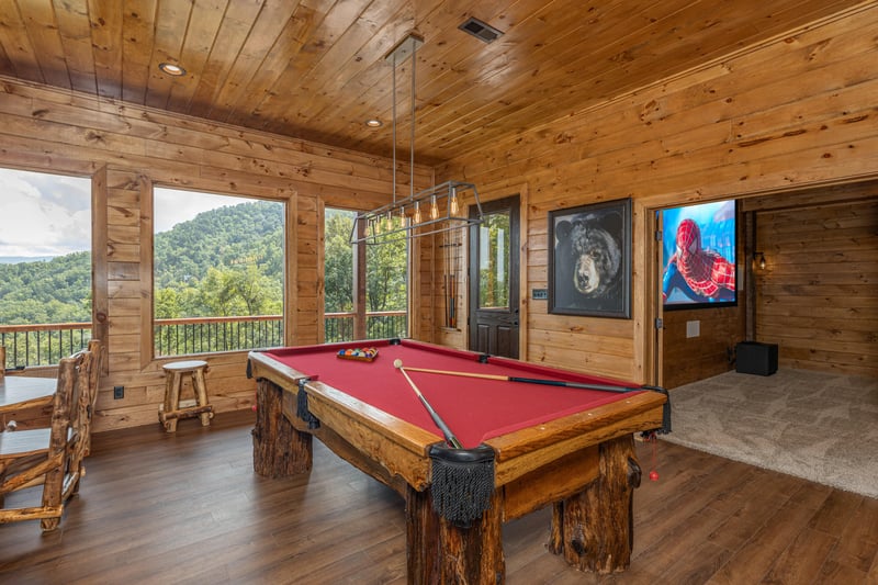 Pool table in the game room at Black Bears  Biscuits Lodge, a 6 bedroom cabin rental located in Pigeon Forge