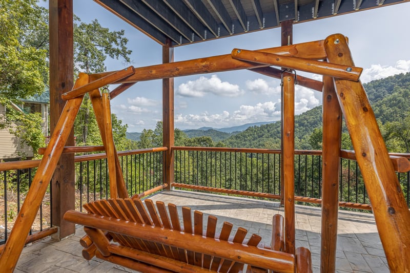 Deck swing at Black Bears  Biscuits Lodge, a 6 bedroom cabin rental located in Pigeon Forge