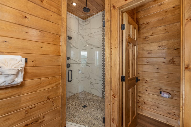 Shower in a corner at Black Bears  Biscuits Lodge, a 6 bedroom cabin rental located in Pigeon Forge