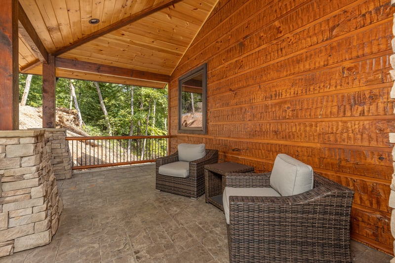 Two chairs and a table outdoors at Black Bears  Biscuits Lodge, a 6 bedroom cabin rental located in Pigeon Forge