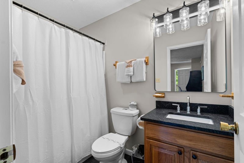 Bathroom with a tub and shower at Wildlife Retreat, a 3 bedroom cabin rental located in Pigeon Forge