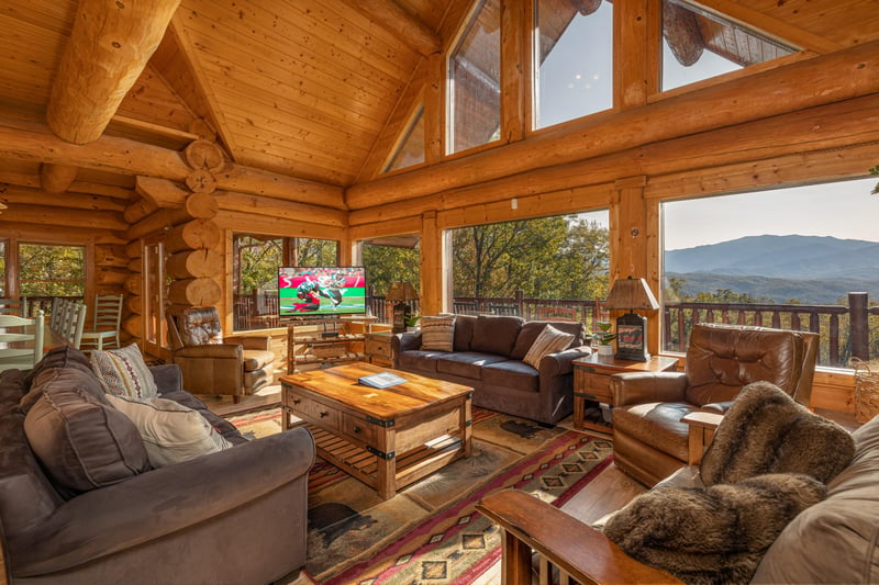 TV and mountain views in the living room at Grizzlys Den, a 5 bedroom cabin rental located in Gatlinburg