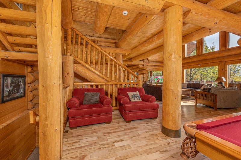 Two large red chairs at Grizzlys Den, a 5 bedroom cabin rental located in Gatlinburg