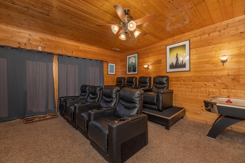 Seating in the theater room at Grizzlys Den, a 5 bedroom cabin rental located in Gatlinburg