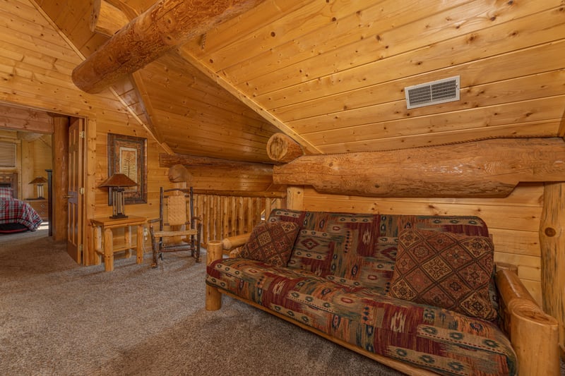 Futon in the loft at Grizzlys Den, a 5 bedroom cabin rental located in Gatlinburg