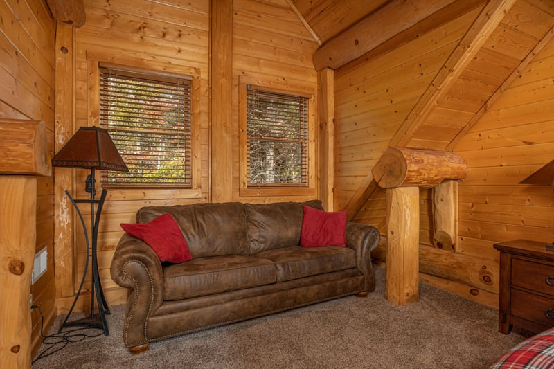 Sofa in a bedroom at Grizzlys Den, a 5 bedroom cabin rental located in Gatlinburg